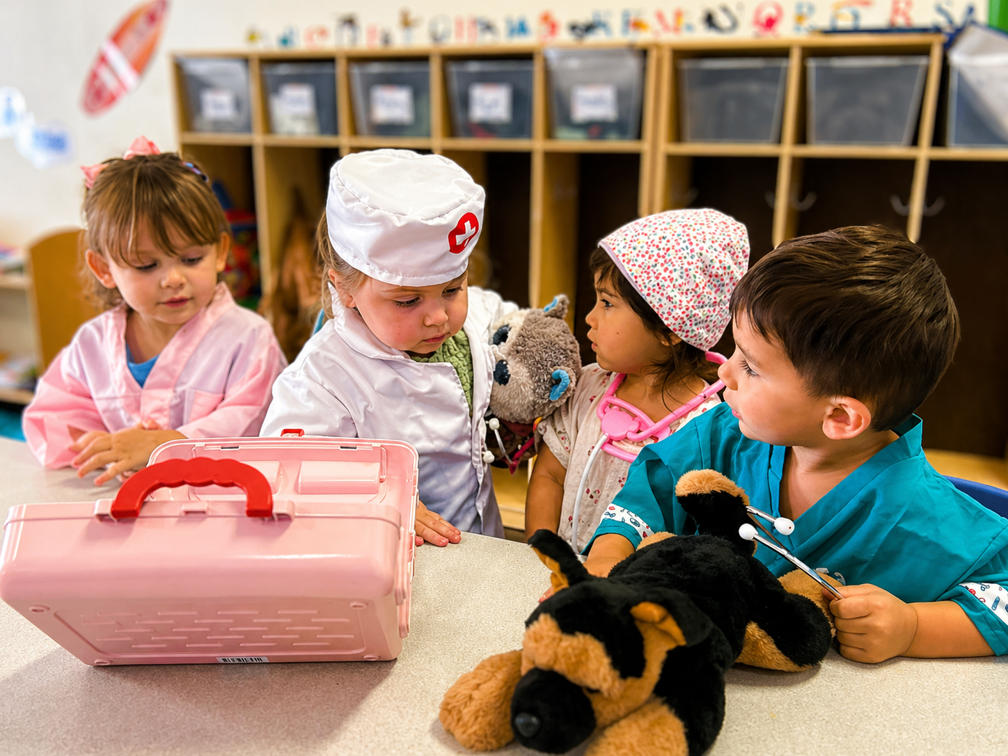 Children enjoying pretend doctor play in the classroom