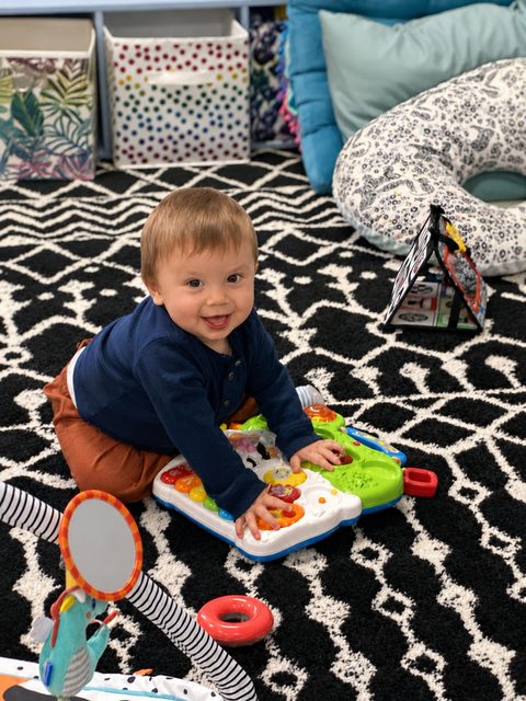 Smiling First Friends child in a playroom
